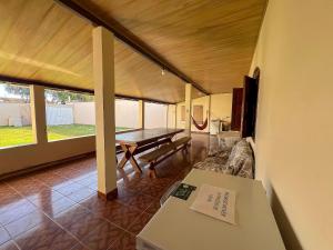 Et opholdsområde på Conforto e praia a poucos passos