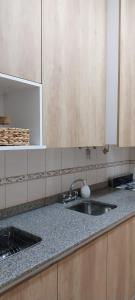 a kitchen with a sink and a counter top at El retamo - Casa Turística in San Rafael