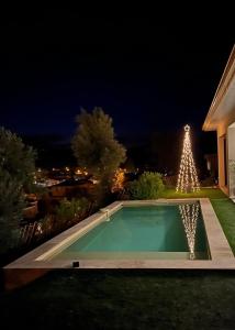 a christmas tree in the yard of a house at Logement entier, Dépendance in Pézenas