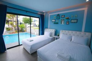 Una cama o camas en una habitación de Spring Vintage Pool Villa บ้านส่วนตัวทั้งหลัง กรุณาระบุผู้เข้าพัก 54 fotos más