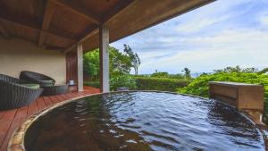 a large pool of water on a patio at Hamachidorinoyu Kaisyu in Shirahama +76 photos