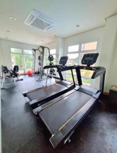 a gym with two treadmills and a treadmill at Camella Verdant - Dolcevita Residence in Puerto Princesa City