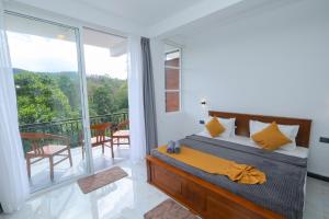 a bedroom with a bed and a balcony at Ivory Canopy Resort - Ella in Ella