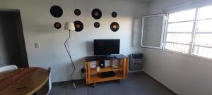 TV a/nebo společenská místnost v ubytování Departamento Patos