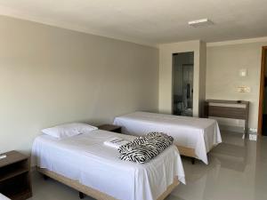 Ένα ή περισσότερα κρεβάτια σε δωμάτιο στο Hotel Nasser Aeroporto