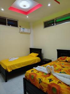 En eller flere senge i et værelse på Departamento Vacacional