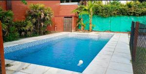 a swimming pool with a ball in the water at Quintacolastinenorte in Santa Fe