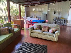 a living room with a couch and a table at Finca La Camila in Coello