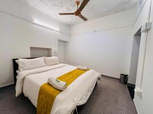 Ένα ή περισσότερα κρεβάτια σε δωμάτιο στο Jaisalmer Hostel Dara