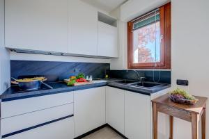 Η κουζίνα ή μικρή κουζίνα στο Appartamento Residenza Chiara - Happy Rentals
