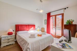 Ένα ή περισσότερα κρεβάτια σε δωμάτιο στο Appartamento Residenza Chiara - Happy Rentals