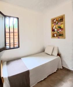 En eller flere senge i et værelse på Casa de Playa