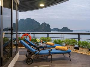 a view of the ocean from the balcony of a house at Lamour Cruise in Ha Long