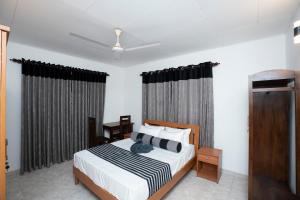 Un pat sau paturi într-o cameră la Brescia Villa - Your Private Escape in Matara