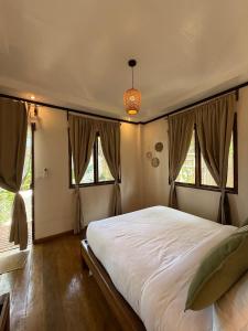 Ένα ή περισσότερα κρεβάτια σε δωμάτιο στο BAIA Tropical