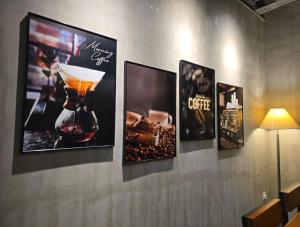 a wall with four pictures of a blender on it at [New!] Jonker Street Loft 3BR Melaka 10PAX in Melaka +23 photos