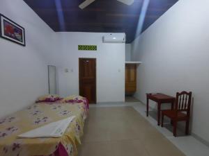 Ένα ή περισσότερα κρεβάτια σε δωμάτιο στο Hospedaje Sadicita