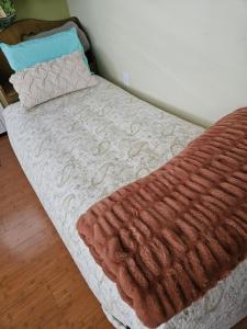 Ένα ή περισσότερα κρεβάτια σε δωμάτιο στο Hale Mapuana