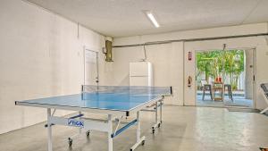a ping pong table in the middle of a room at Island Escape - 638 in Siesta Key