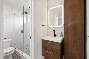 a bathroom with a toilet and a sink and a shower at Contemporary Couples Getaway Near Austin Favorites - Loft 21 in Austin