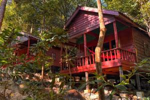 a wooden house in the middle of a forest at Prey Apsara Bungalows in Koh Rong