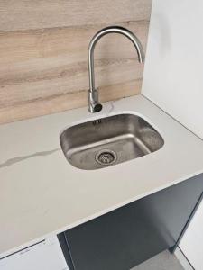 a stainless steel sink in a kitchen counter at PinotageLuxuryCollection 14 Bastmolen in Stellenbosch