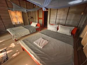 an overhead view of a bedroom with two beds at Prey Apsara Bungalows in Koh Rong
