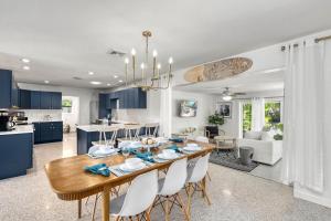a kitchen and living room with a wooden table and chairs at Siesta Dolce - 3750 in Siesta Key