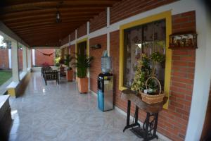 a patio with a drink dispenser on the side of a building at Caraná in Pueblo Tapao