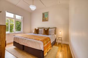 Ένα ή περισσότερα κρεβάτια σε δωμάτιο στο The Bach In Mangawhai