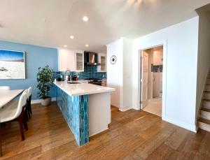 a kitchen with a sink and a counter top at Malibu Waterfront Gallery with Private Beach Access in Malibu Beach