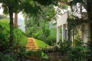 a stairway leading to a house with a garden at Namara Green Ella in Ella