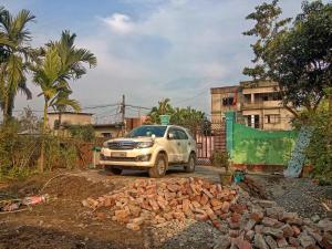 a truck parked next to a pile of rubble at SKY VIEW Home Stay in Siliguri +8 photos