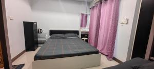 a bedroom with a bed with a blue mattress at The European House Pattaya in North Pattaya +22 photos