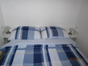 Postel nebo postele na pokoji v ubytování Apartments & Room Toni