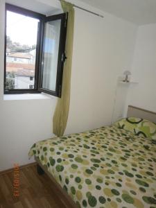 Postel nebo postele na pokoji v ubytování Apartments & Room Toni