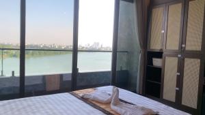 Ένα ή περισσότερα κρεβάτια σε δωμάτιο στο MD Hotel