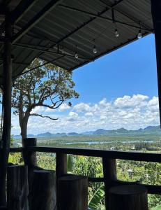 a view from the porch of a house with a view at BaanPhutawanLanta in Ban Mo Nae