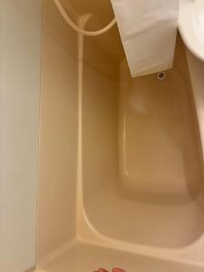 a bath tub in a bathroom with a sink at SJins in Tokyo +1 photo