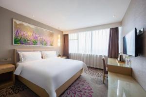 Postel nebo postele na pokoji v ubytování Lavande Hotel Jinan Quancheng Road Baotu Spring Branch