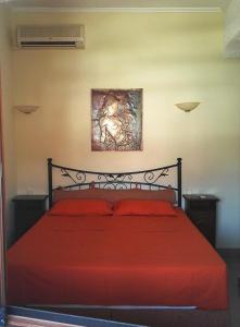 En eller flere senge i et værelse på Villa Dimitra