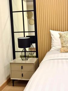 Ένα ή περισσότερα κρεβάτια σε δωμάτιο στο โรงแรมเดอะไนน์ พรีเมียร์