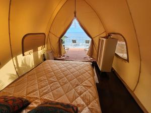 Ένα ή περισσότερα κρεβάτια σε δωμάτιο στο A Slice of Paradise