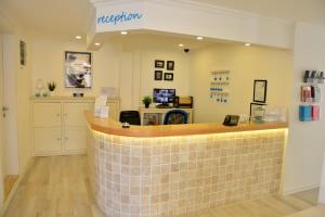 a reception area of a salon with a tile counter at Minu Hotel in Fethiye