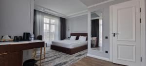 Ένα ή περισσότερα κρεβάτια σε δωμάτιο στο Noble Samarkand +65 φωτογραφίες