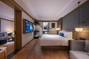 Postel nebo postele na pokoji v ubytování Manxin Mansion, Tiananmen Square, Forbidden City, Beijing