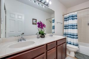 a bathroom with a sink and a toilet at Stunning Home near Universal Kids Resort, Frisco in Little Elm +11 photos