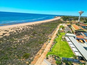 an aerial view of the beach and the ocean at Pilbara Cabin Affordable 1x1 in Port Hedland