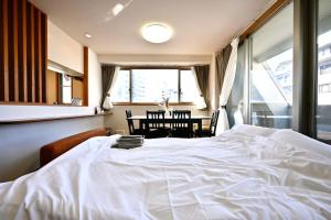 Giường trong phòng chung tại コングラッツ湘南