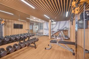 a fitness room with a treadmill and a gym at Amaya Saigon Boutique Hotel in Ho Chi Minh City
